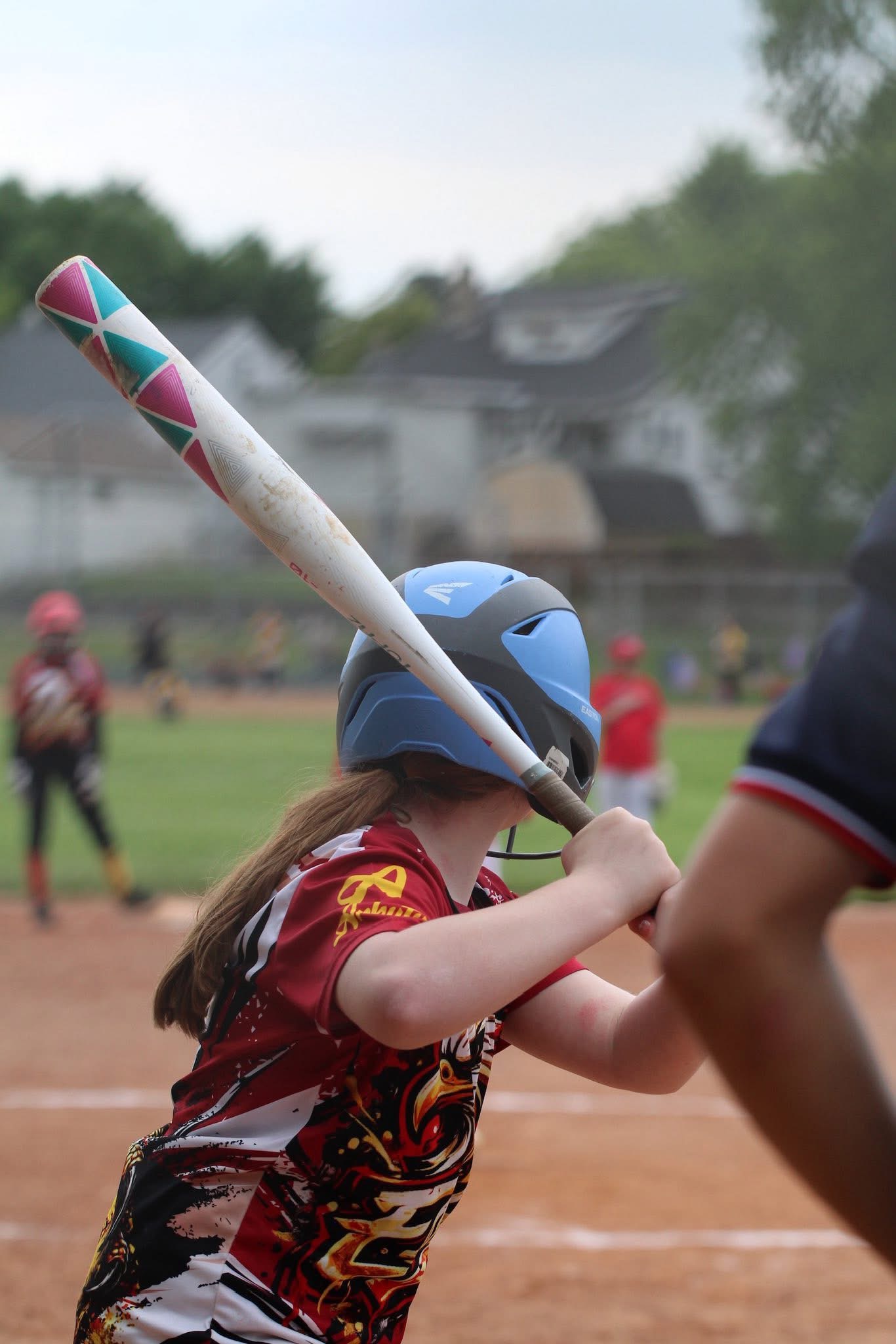 Lady Eagles player holding her bat while preparing to hit