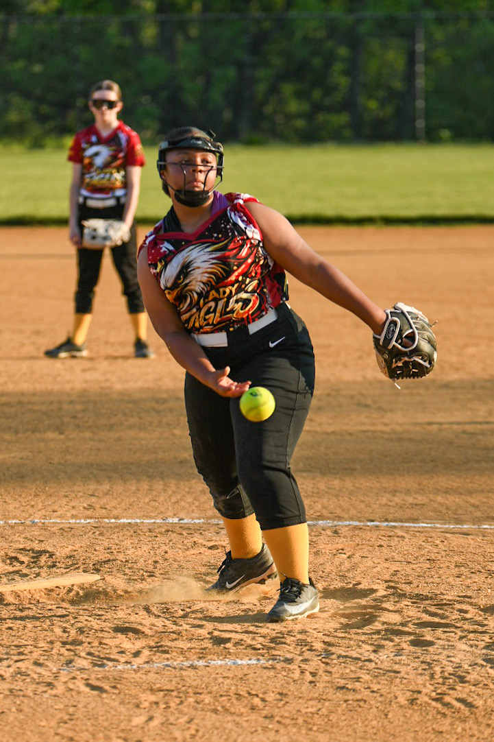 Lady Eagles pitcher delivering a softball